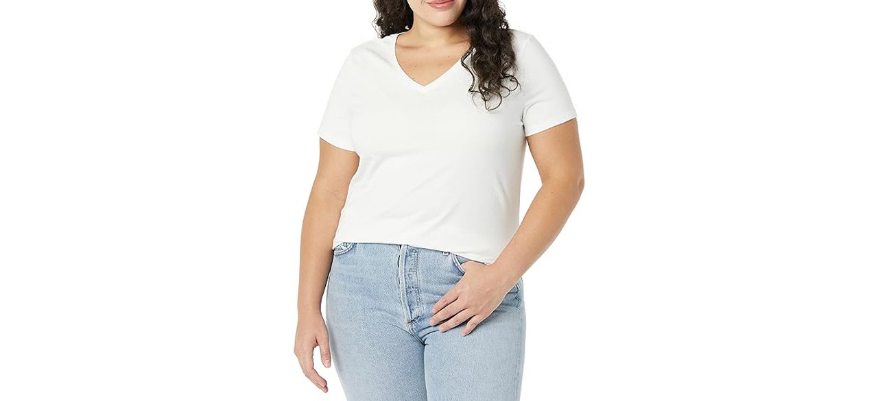 Woman wearing white Amazon Essentials Women's Classic-Fit Short-Sleeve V-Neck T-Shirt