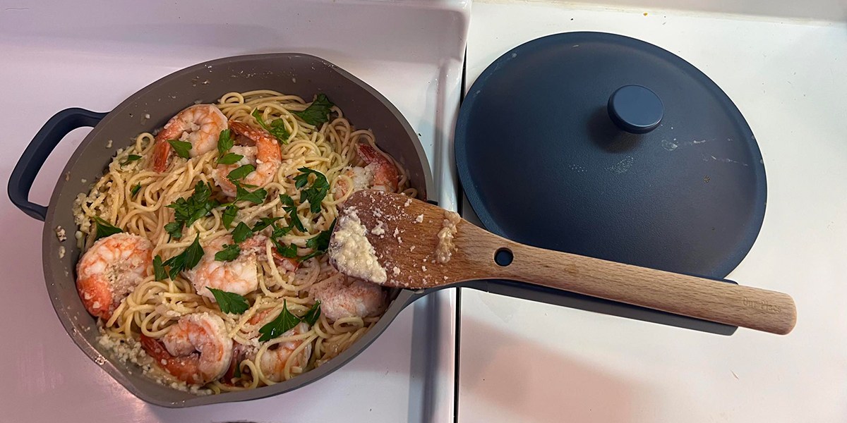 Saute pan with shrimp and pasta inside