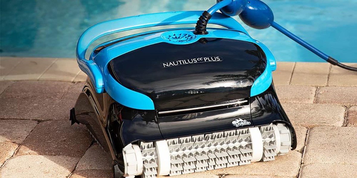 Dolphin Nautilus CC Plus Wi-Fi Robotic Pool Vacuum Cleaner on patio next to pool