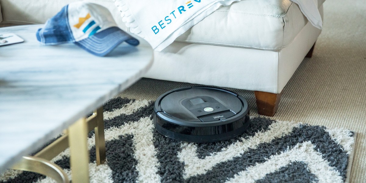 Roomba in bedroom moving under bed