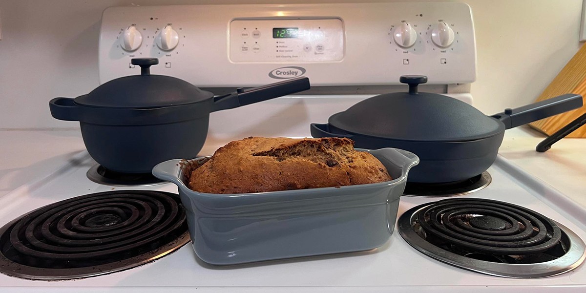 Our Place Ultimate Cookware Set on stovetop with banana bread in pan