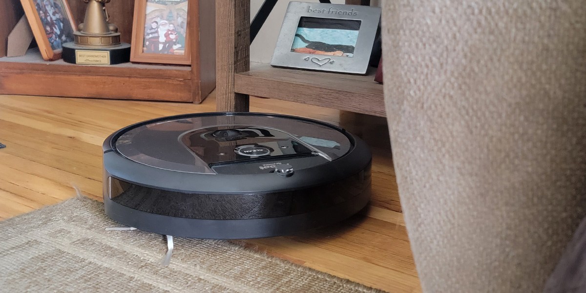 Roomba navigates its way from hardwood flooring toward carpeted area