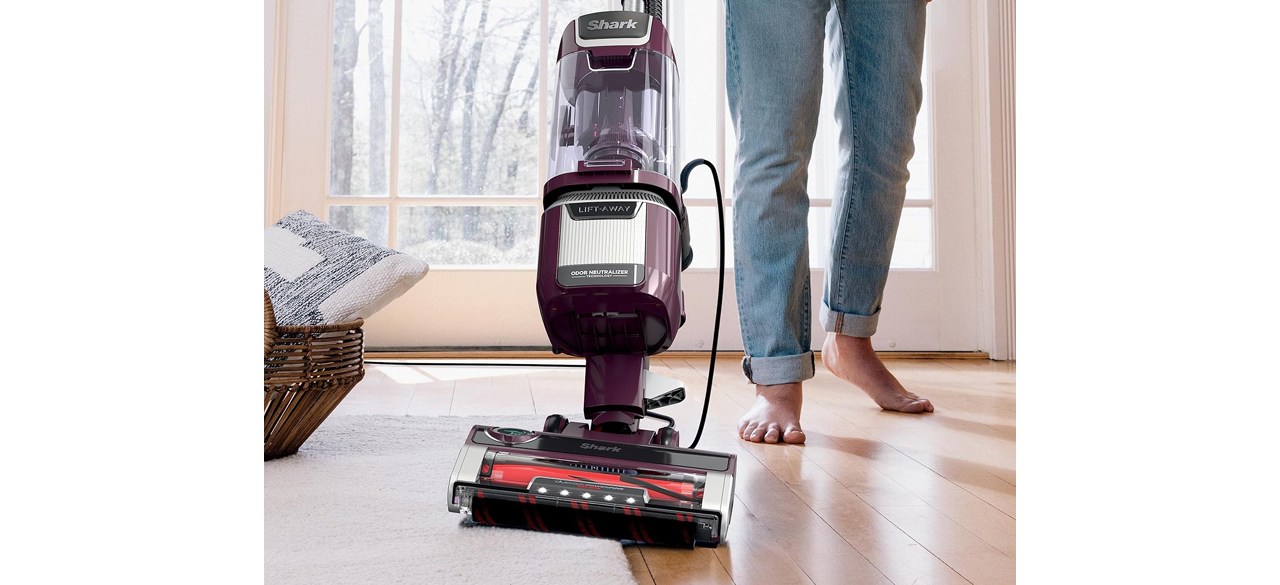 Person cleaning hard flooring with Shark Rotator Pet Lift-Away ADV Upright Vacuum with DuoClean PowerFins HairPro and Odor Neutralizer Technology 