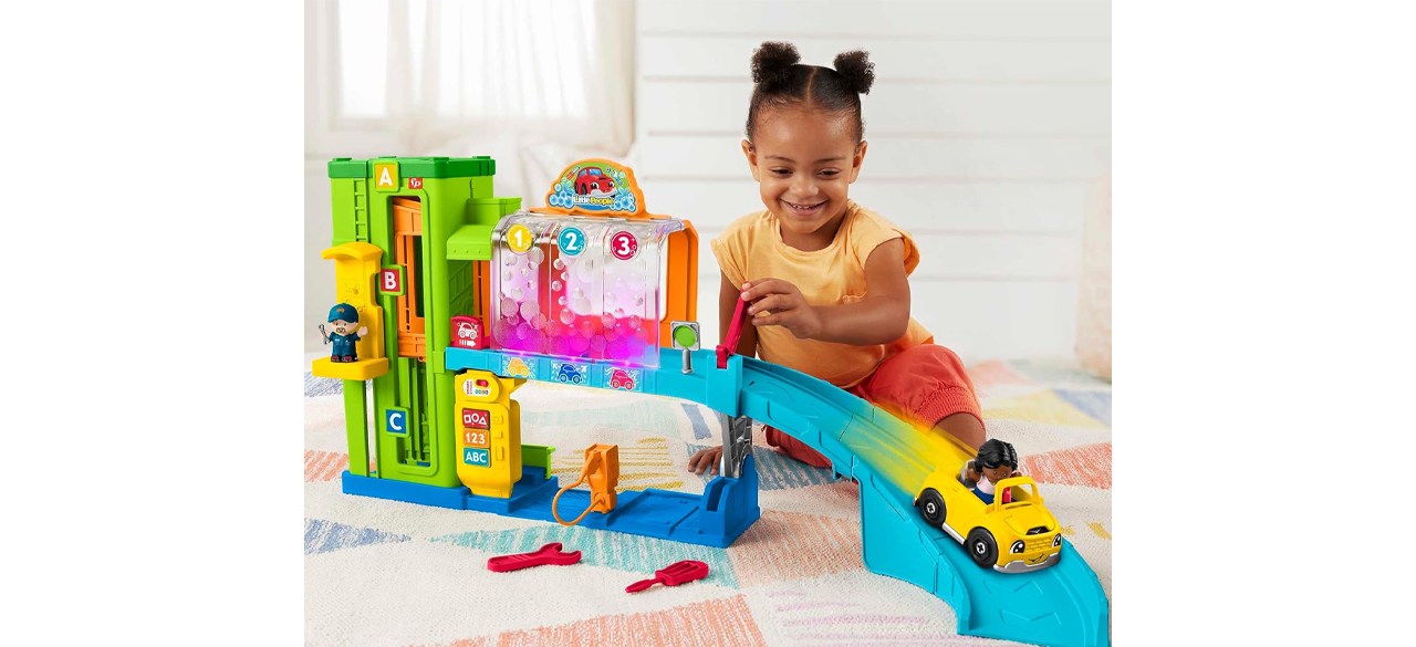 Child playing with Fisher-Price Little People Toddler Playset