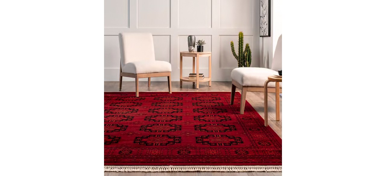 Red Hailey Persian Trellis Area Rug in front of white chairs