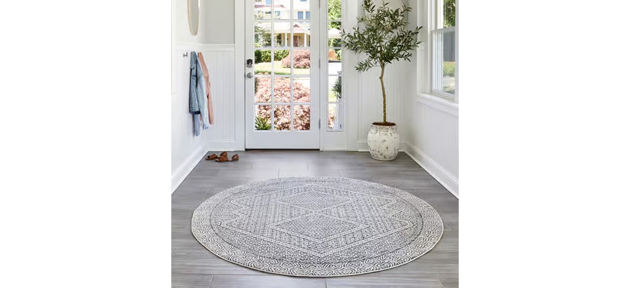 Grey Diamond Mosaic Area Rug in front of door and plant