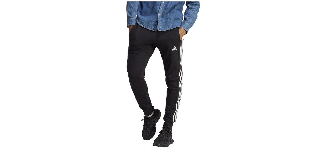 adidas Men's Essentials French Terry Cuffed 3-Stripes Pants on white background