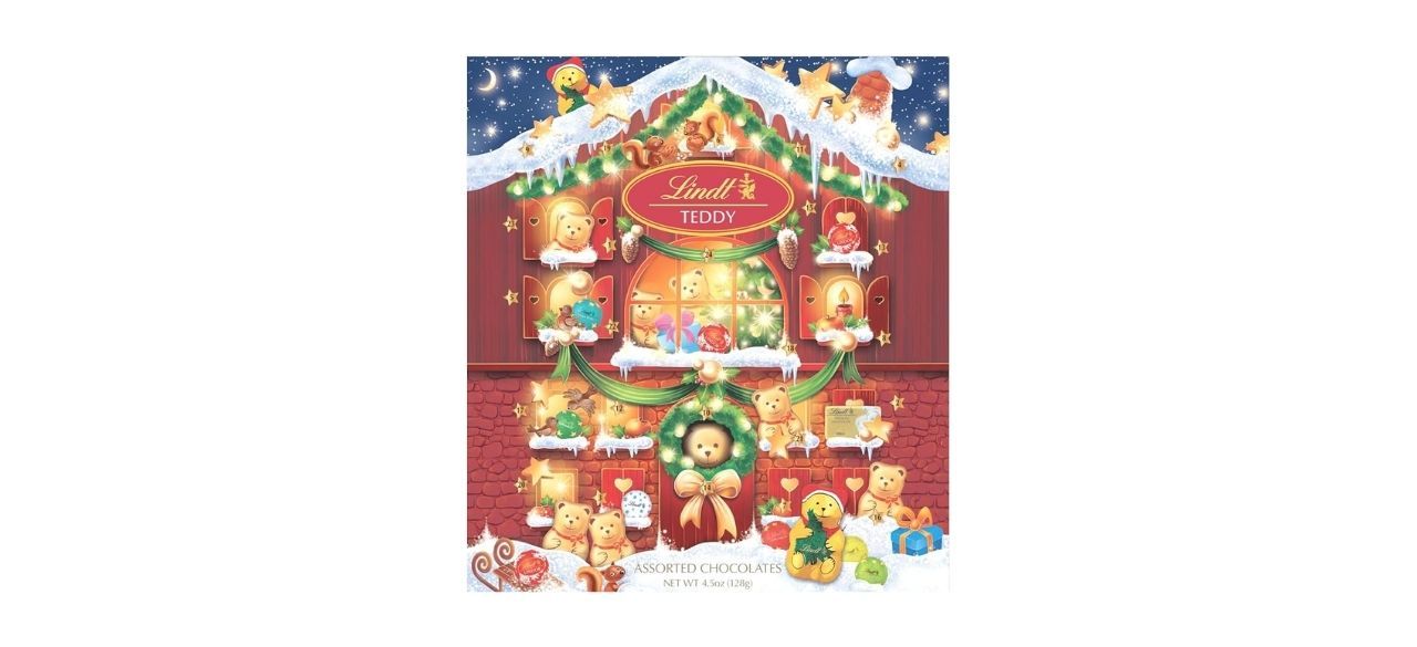 An advent calendar with images of a snowy house and teddy bears