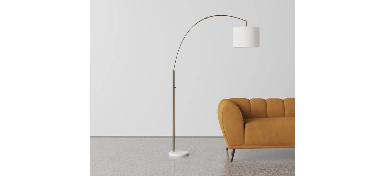 AllModern Felice Smart-Enabled Arched Floor Lamp next to yellow sofa