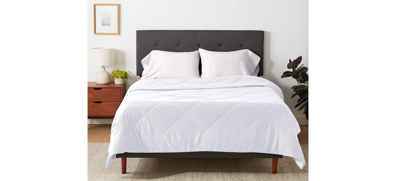 White Amazon Basics Reversible, Lightweight Microfiber Comforter Blanket on bed