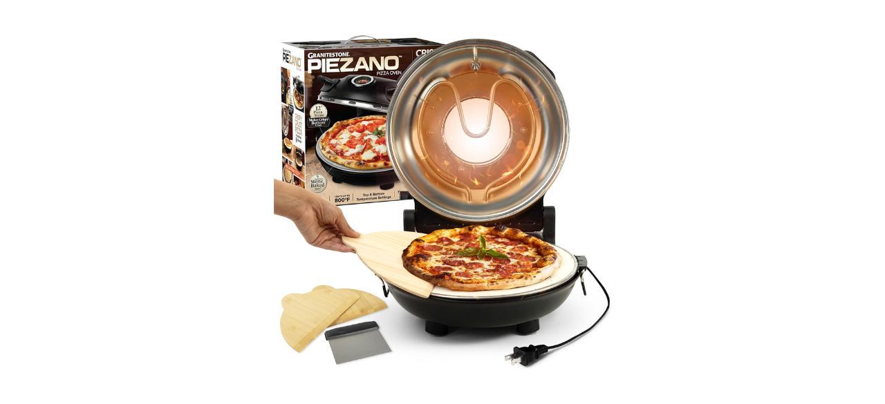 Man putting pizza in granite piezano pizza oven