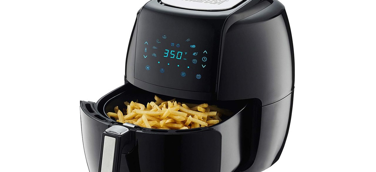 Black air fryer on black background