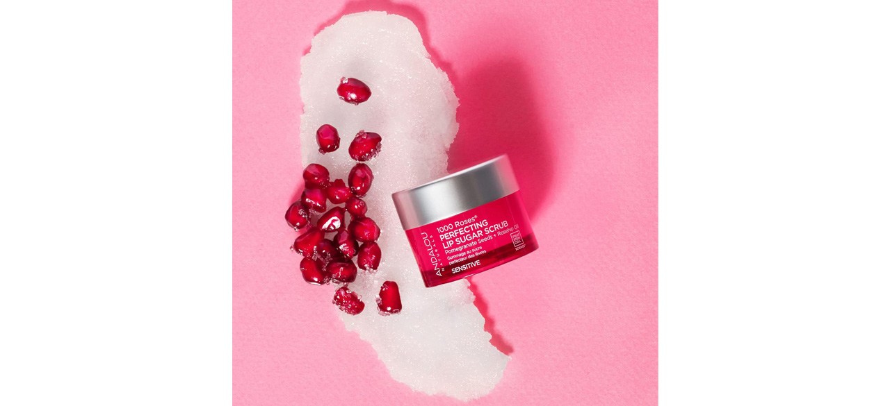 Andalou Naturals 1000 ROSES Perfecting Lip Sugar Scrub on pink background