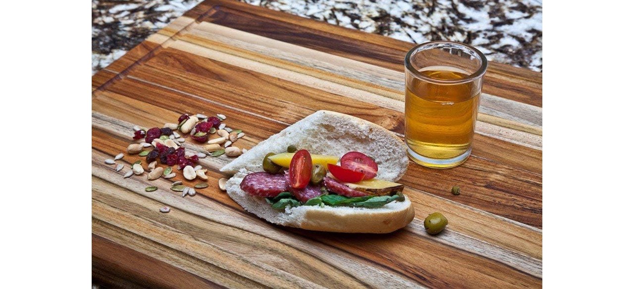 Teakhaus Cutting Board with food and beverage 