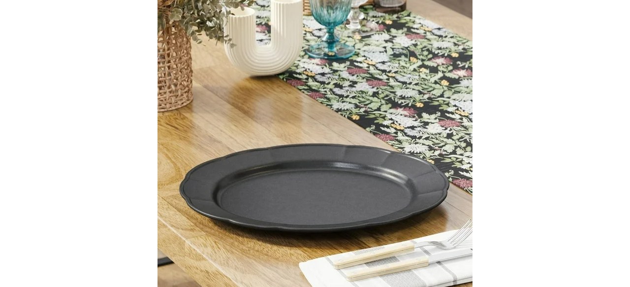 Beautiful Scallop 15.5 Inch Platter in Black on table