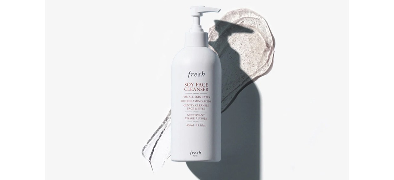 White bottle of fresh Soy pH-Balanced Hydrating Face Wash with some of the face wash smeared in the background