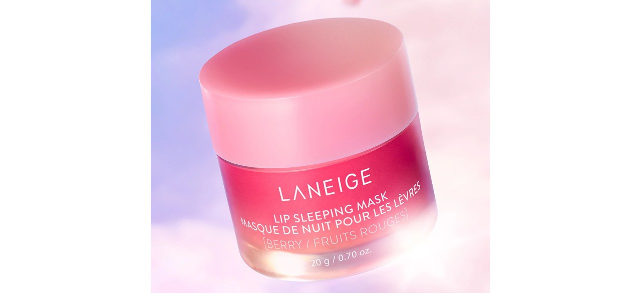 Pink container of LANEIGE Lip Sleeping Mask floating against a purple and light pink background