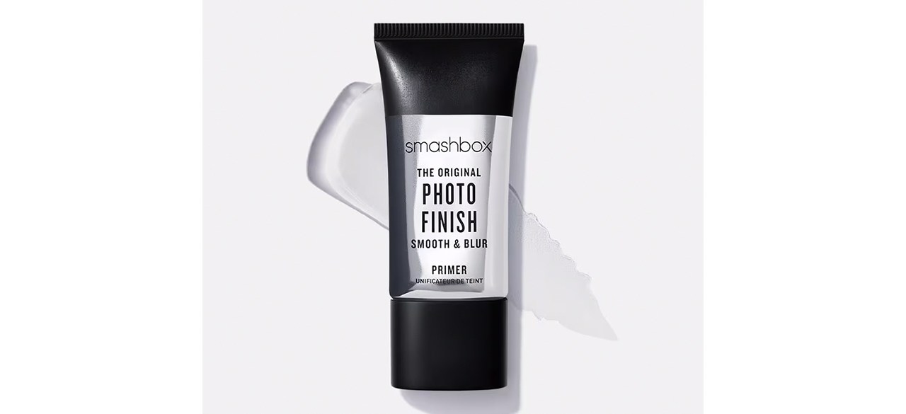 A black and gray squeeze bottle of Smashbox Photo Finish Foundation Primer with some of the primer smeared behind the bottle.