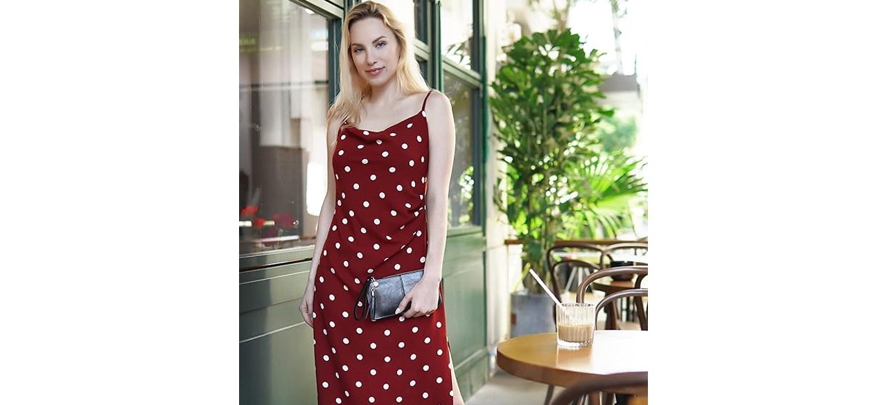 Woman in burgundy dress holding befen Genuine Leather Wristlet Clutch Purse