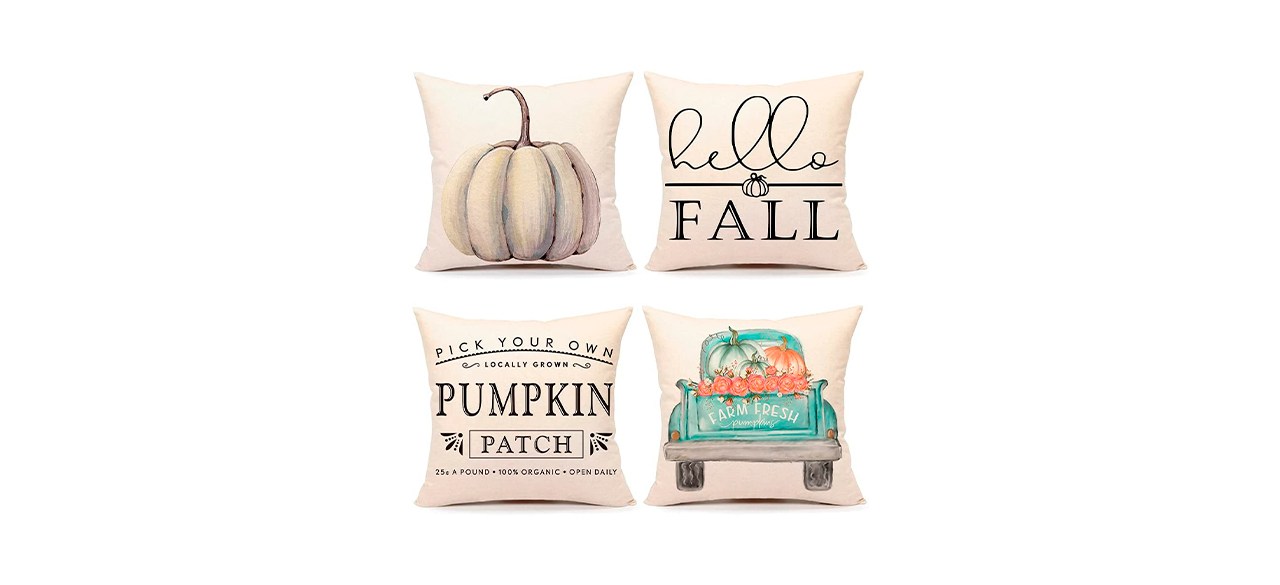 4 light beige square pillows; one has a white pumpkin on it; one says "hello fall"; one says "pick your own locally grown pumpkin patch" on it; one has an aqua pickup truck with pumpkins in the back on it. 