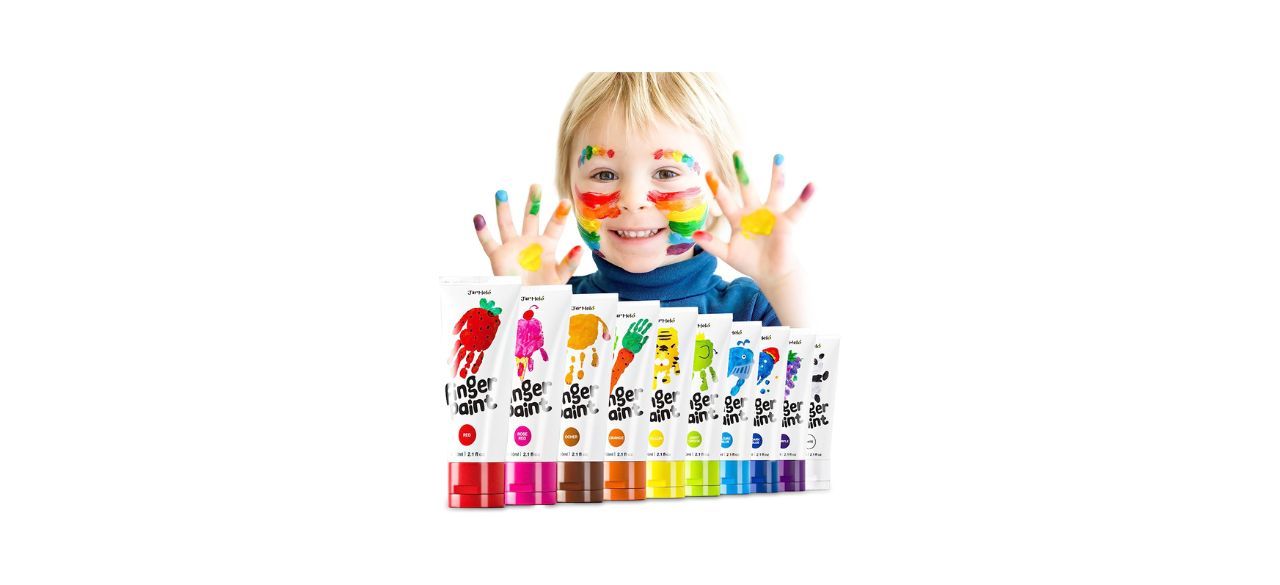 a toddler with some fingerpaints of various colors