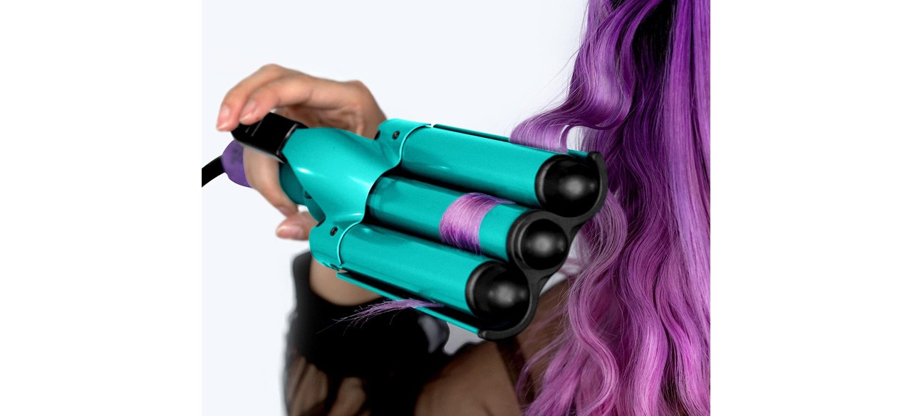 Person with purple hair using Bed Head Wave Affair Jumbo 3 Barrel Hair Waver