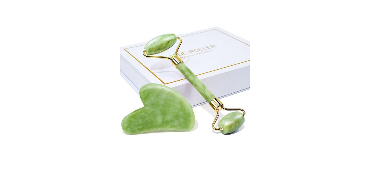 A green jade face roller and a jade gua sha scraping tool