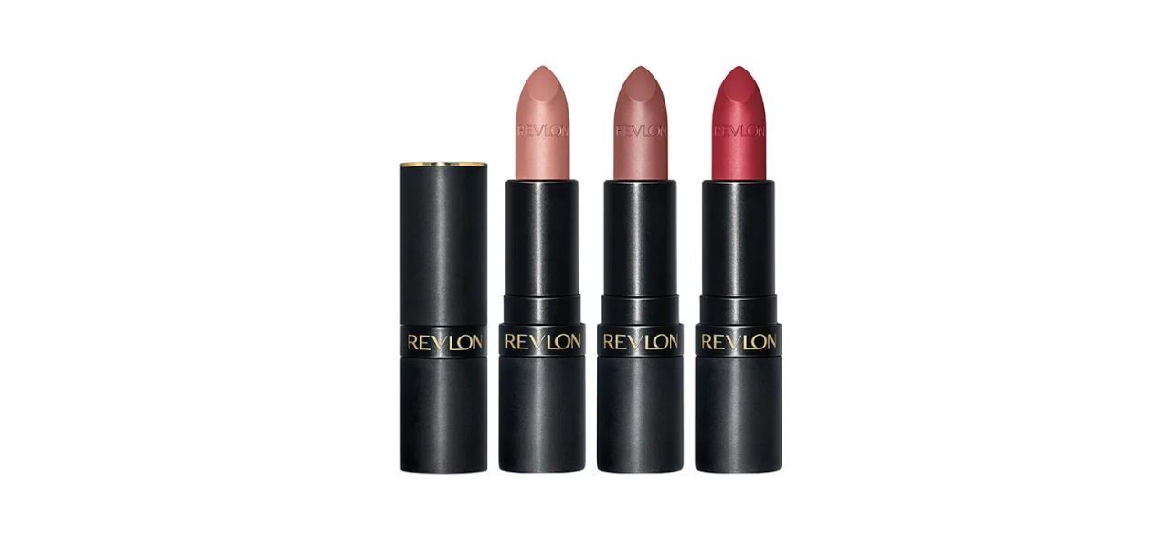 Three matte lipsticks in a light peach color, a mauve color, and a bright red color