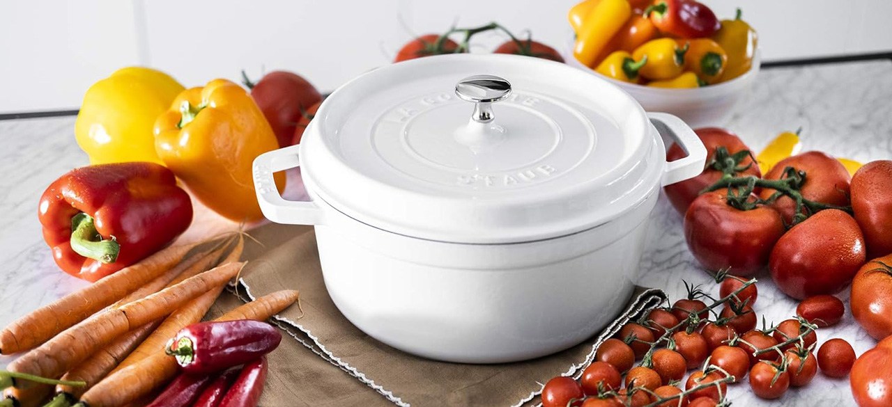 White STAUB Cast Iron Dutch Oven 4-qt Round Cocotte surrounded by vegetables