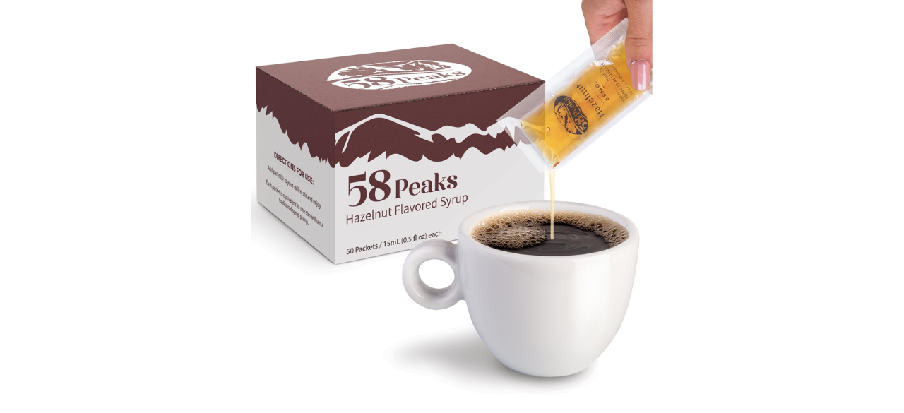 58Peaks hazelnut sweetener packs and coffee on white background