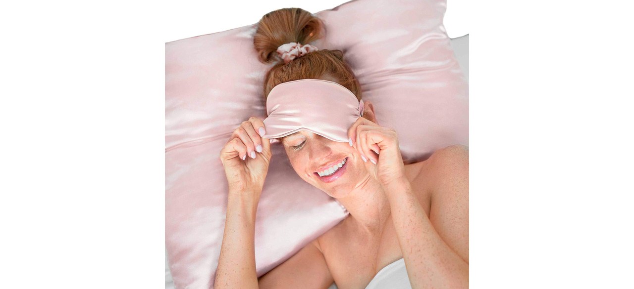 Woman using pink Kitsch Satin Sleep Mask