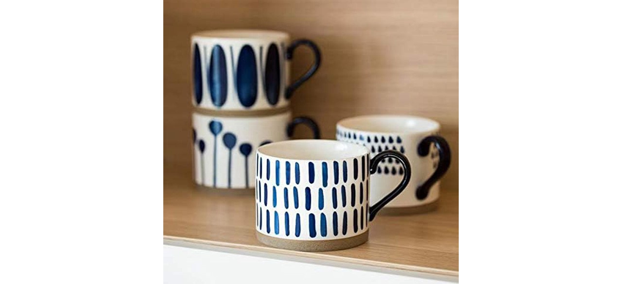 Koja Hand Painted 15 oz. Porcelain Ceramic Mugs on shelf