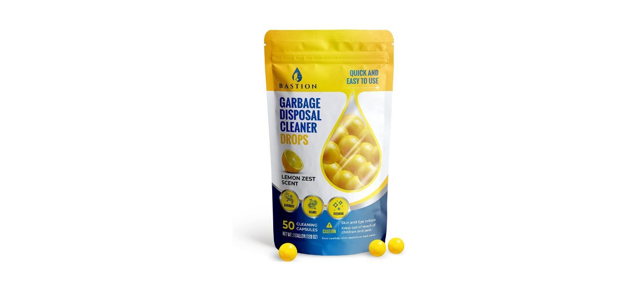 A bag of garbage disposal cleaner drops. Packaging says there are 50 "lemon zest scent" drops inside the bag.