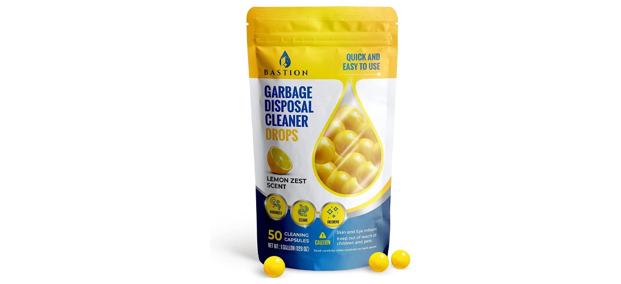 A bag of garbage disposal cleaner drops. Packaging says there are 50 "lemon zest scent" drops inside the bag.