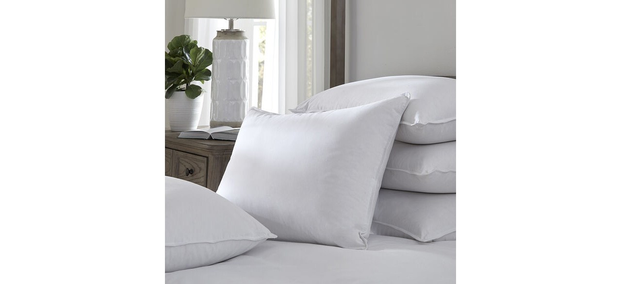 Pacific Coast Heritage Double Support Slumber Pillow in white, sitting on a bed next to other pillows