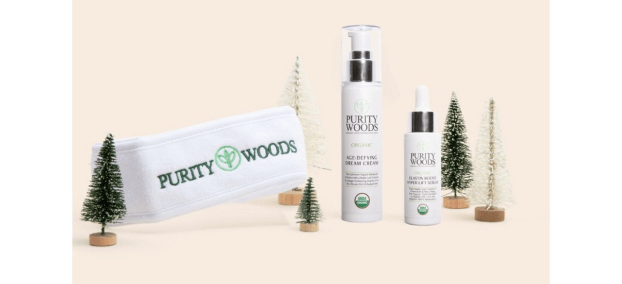 Purity Woods Lift Smooth and Illuminate Bundle next to decorative Christmas tree figurines