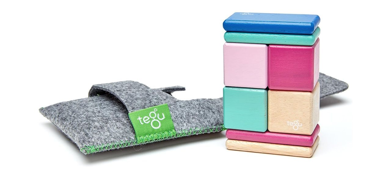 Tegu wooden block set and pouch on white background