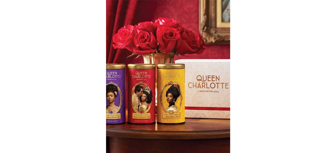 Queen Charlotte Three Tea Gift on table in front of roses