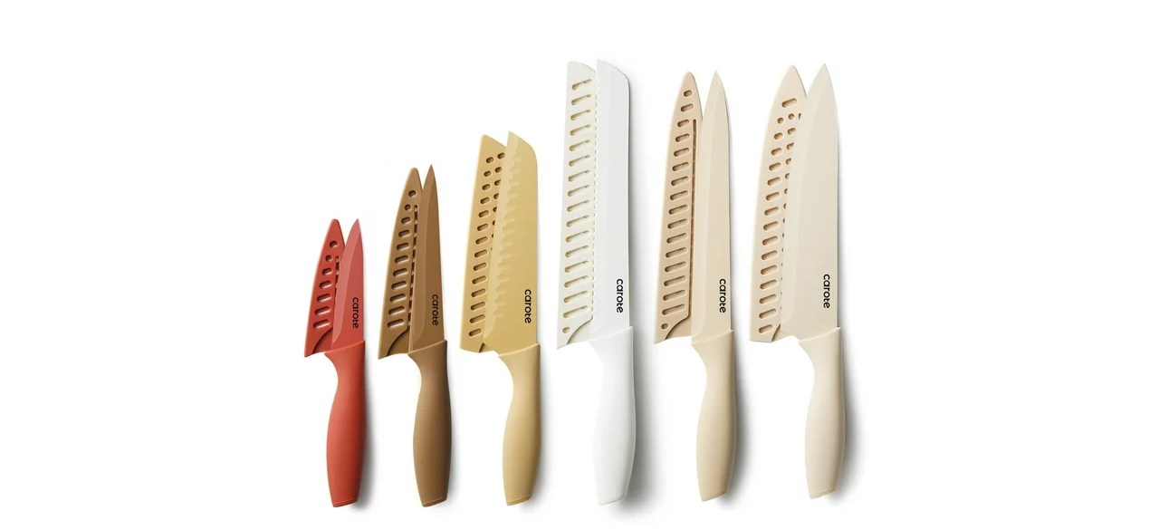 A 12-piece Carote knife set in a variety of earth tone colors.