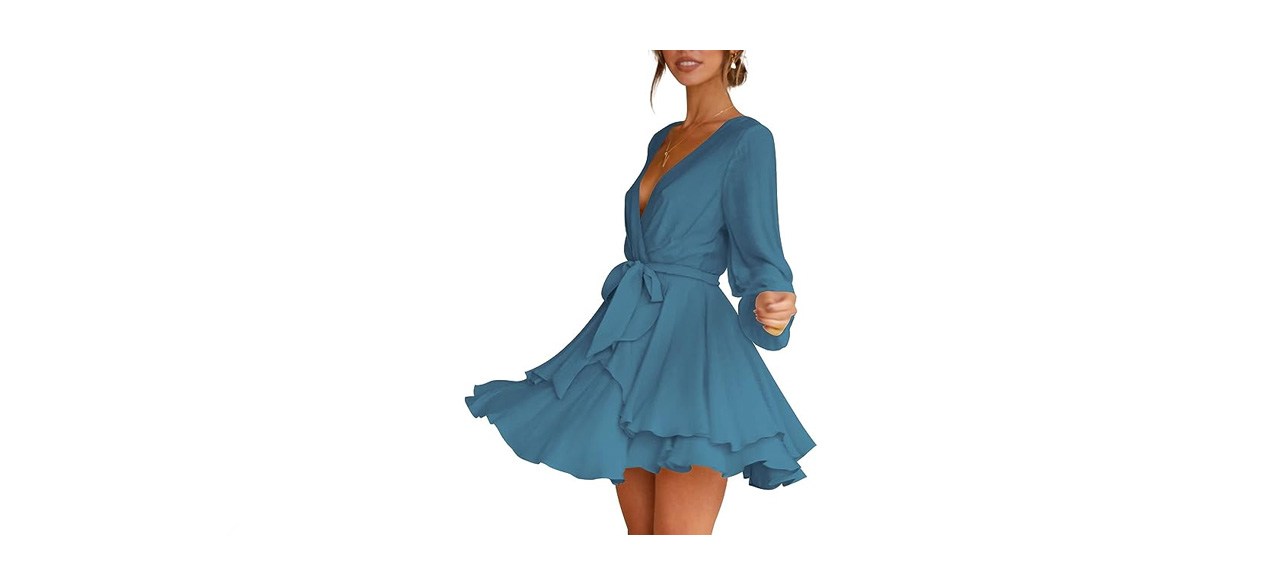 a woman in a long-sleeved teal dress