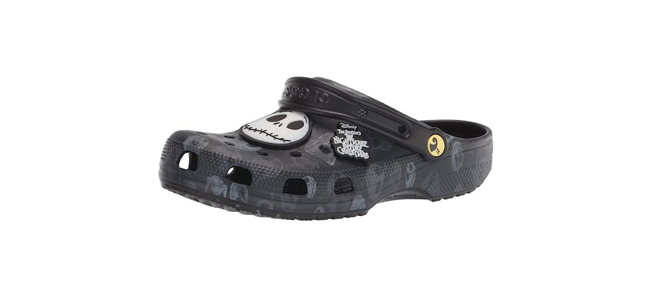 black clogs with an emblem of Jack Skellington's face and printed skulls on them