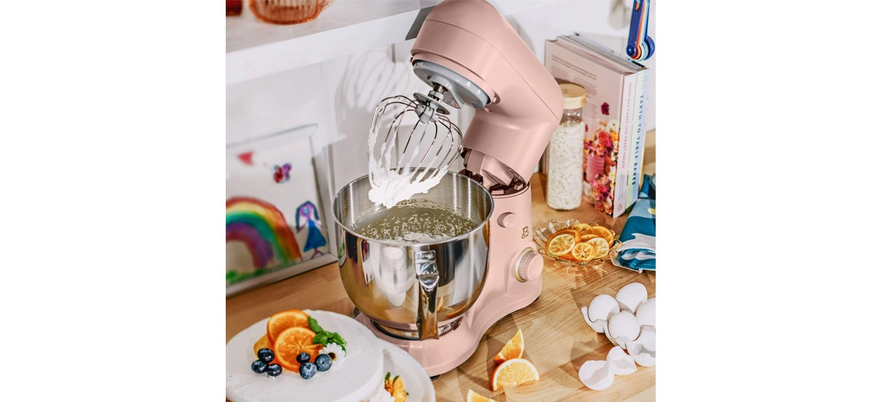 Beautiful 5.3 Qt Stand Mixer in Rose with attachment on countertop