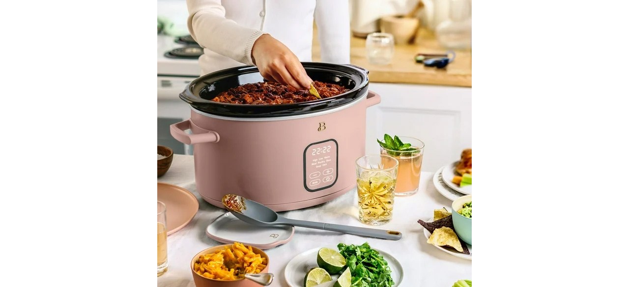 Person cooking in Rose Beautiful 6 Qt Programmable Slow Cooker