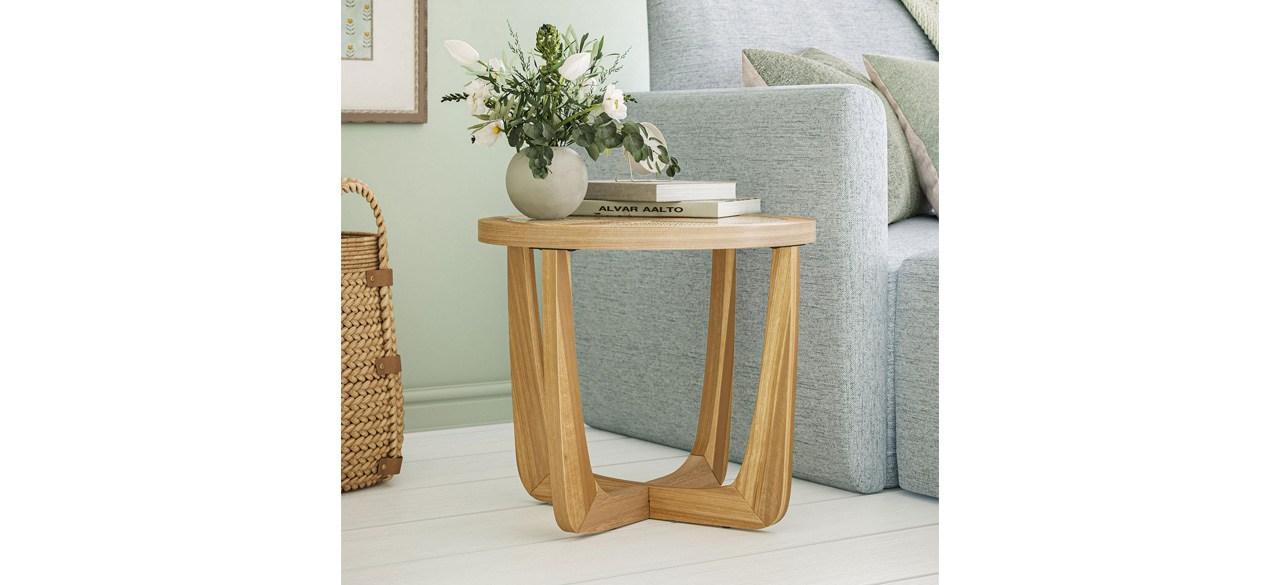 Beautiful rattan and glass side table next to the sofa