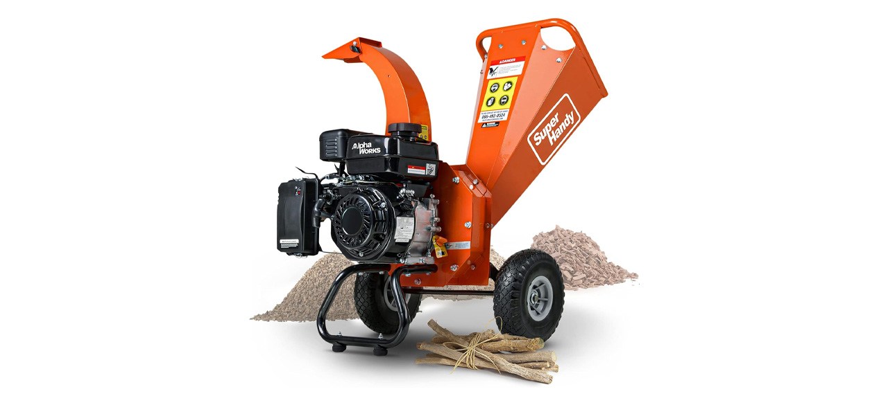 Orange and black mini wood chipper on white background