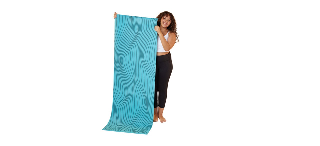 Person holding Series 8-Fitness Optical Print Yoga Mat on white background