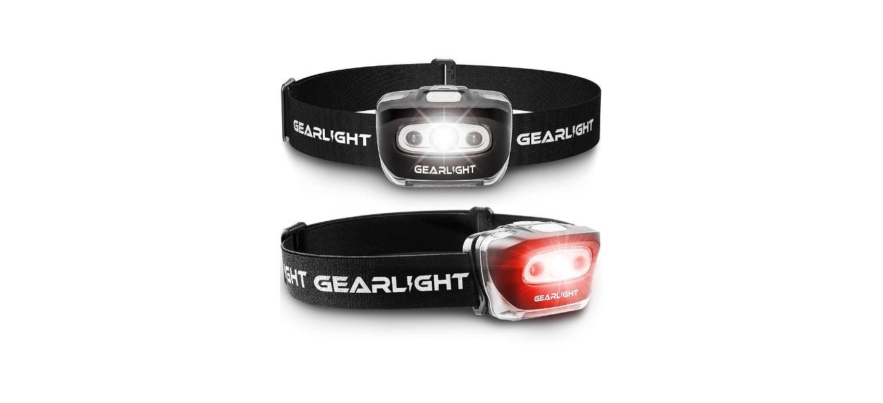 A pack of two headlamps. One bulb is red and one bulb is white.