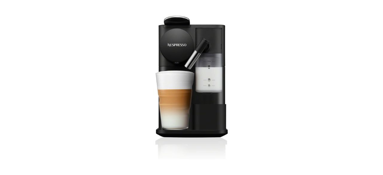 black Nespresso Lattissima One Original Espresso Machine with coffee beverage under spout with frothed milk