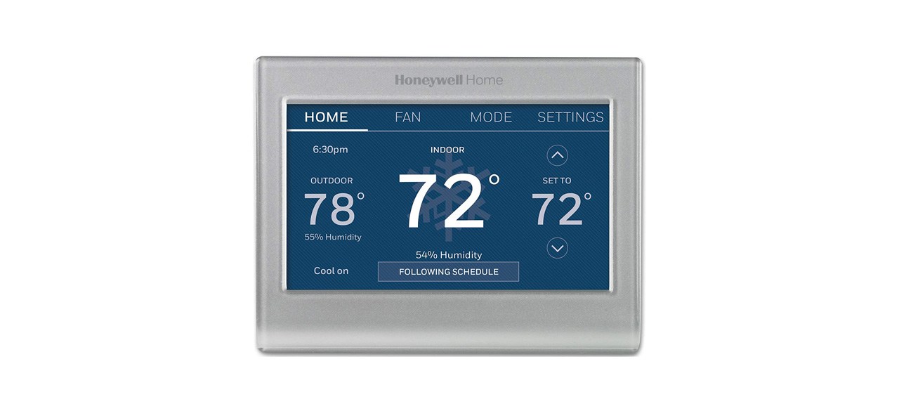 A smart home thermostat with a blue display