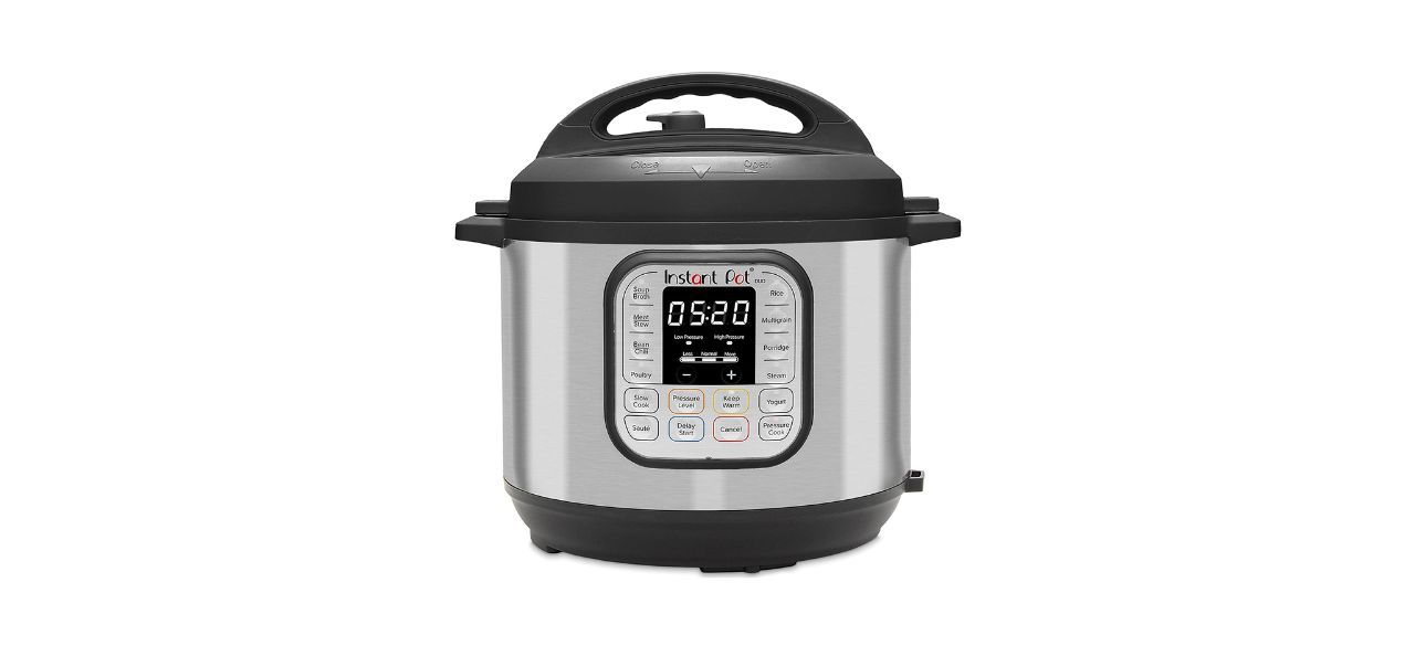 a stainless steel instant pot with a black lid on a white background